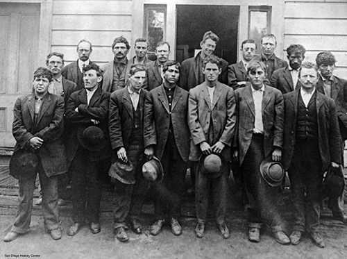 Group of men at school house